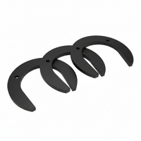 Three black horseshoes on a light blue background