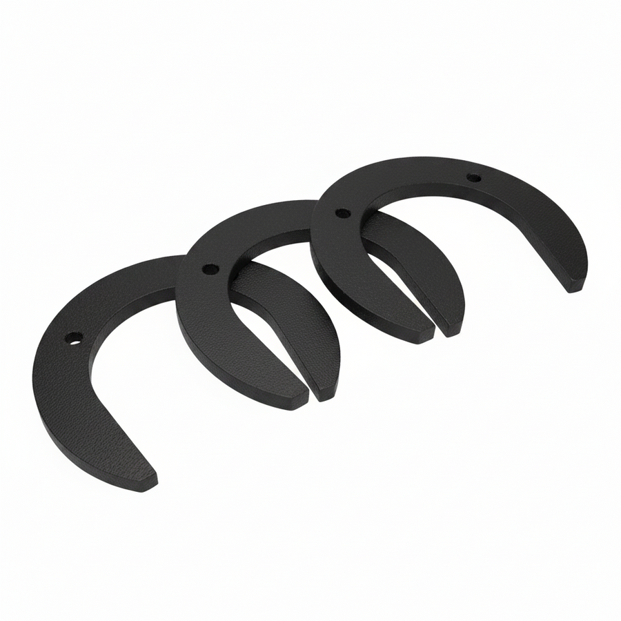 Three black horseshoes on a light blue background
